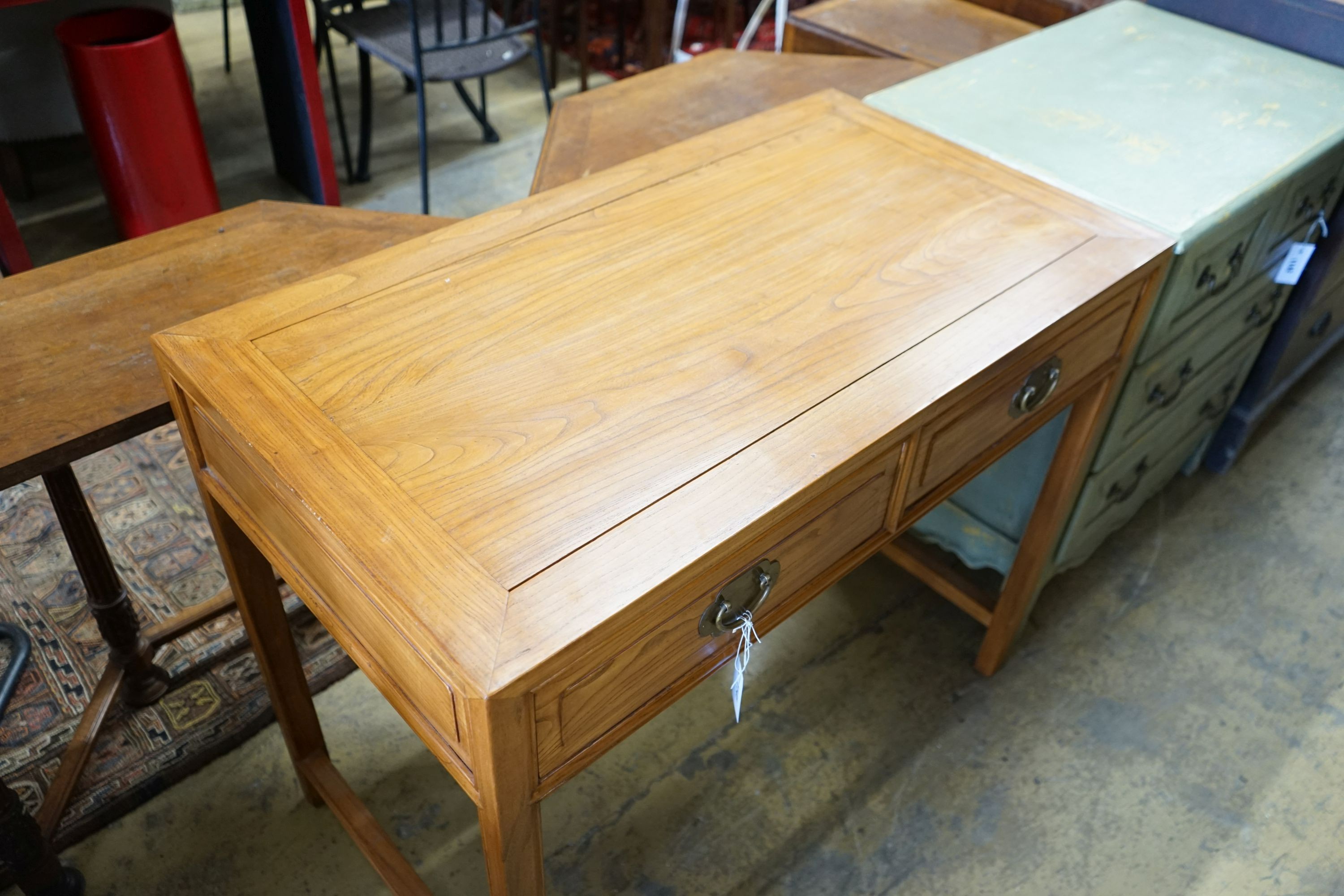 A Chinese elm two drawer side table, width 101cm depth 56cm height 84cm